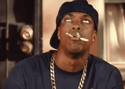 Man Smoking Cigarette With Hat And Chains GIF