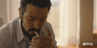 Man Smoking Cigarette With Netflix Logo GIF