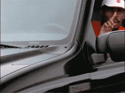 Man Smoking In Car With White Hat Letter R GIF