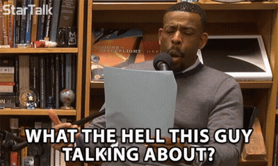Man Speaking Into Mic Saying What The Hell This Guy Talking About GIF