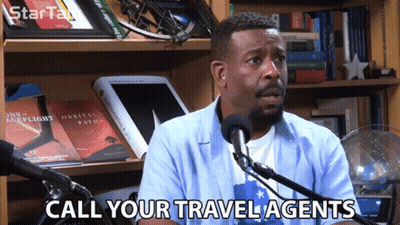 Man Speaking Into Microphone Call Your Travel Agents GIF