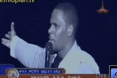 Man Speaking Into Microphone On TV GIF