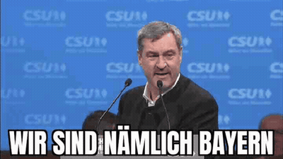 Man Speaking Into Microphone Wir Sind Namlich Bayern GIF
