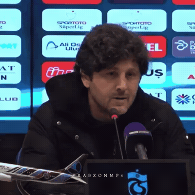 Man Speaking Into Microphone With Spor Toto Superlig Screen GIF