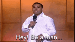 Man Speaking On Mic Hey Be A Man GIF