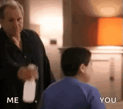 Man Spraying Boy With Water GIF
