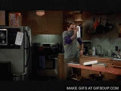 Man Spraying In Kitchen GIF
