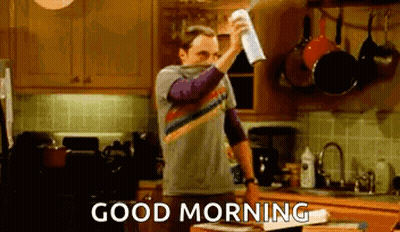 Man Spraying Napkin In Kitchen Saying Good Morning GIF