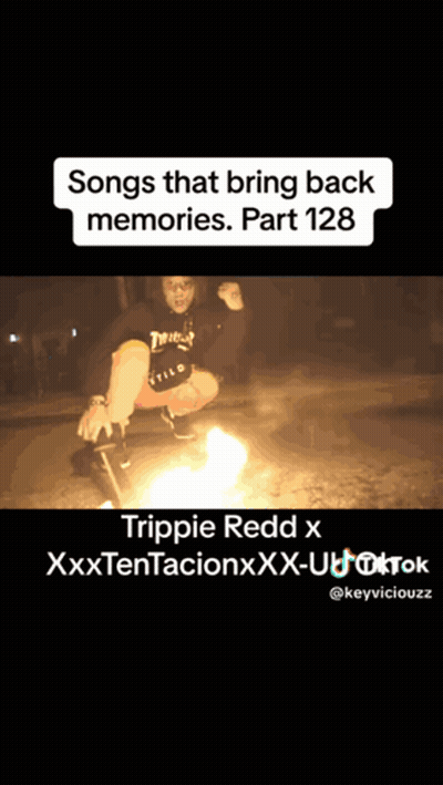 Man Squatting By Fire Saying Songs That Bring Back Memories GIF