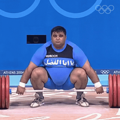Man Squatting Holding Barbell Athens 2004 GIF
