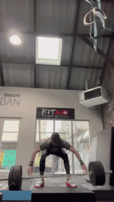 Man Squatting In Front Of Fit Sign GIF