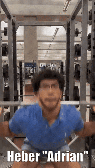 Man Squatting In Gym Saying Heber Adrian GIF