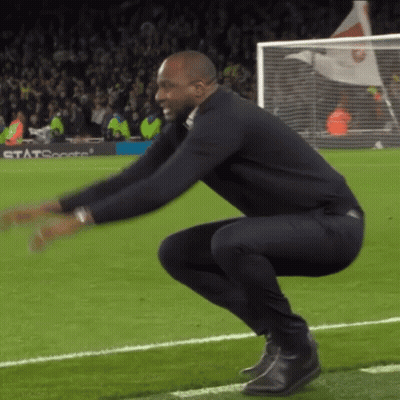 Man Squatting On Soccer Field GIF