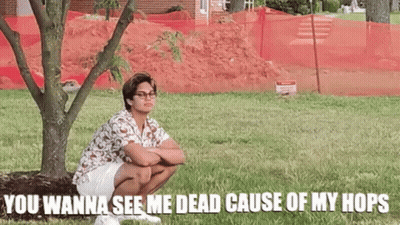 Man Squatting Under Tree With Funny Caption GIF
