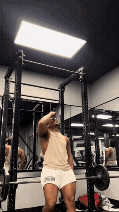 Man Squatting With Barbell In Gym Wearing Longshark Tank Top GIF