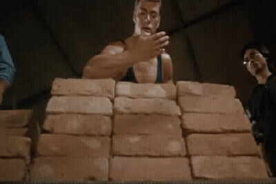 Man Stacking Bricks GIF