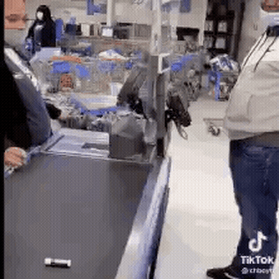 Man Standing At Checkout Counter GIF