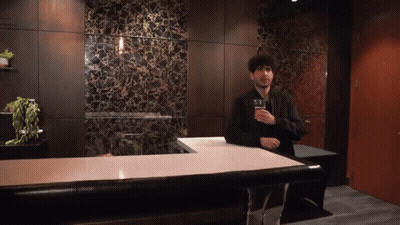 Man Standing At Counter With Beer GIF
