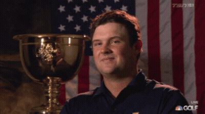 Man Standing Before American Flag And Trophy GIF