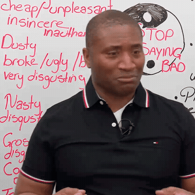 Man Standing Before Cheap Unpleasant Sign GIF