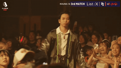 Man Standing Before Crowd With Asahi GIF