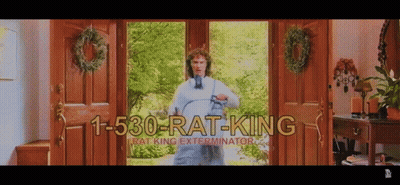 Man Standing Before Door Numbered 1-530-Rat-King GIF