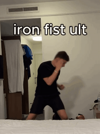 Man Standing Before Iron Fist Ult Wall