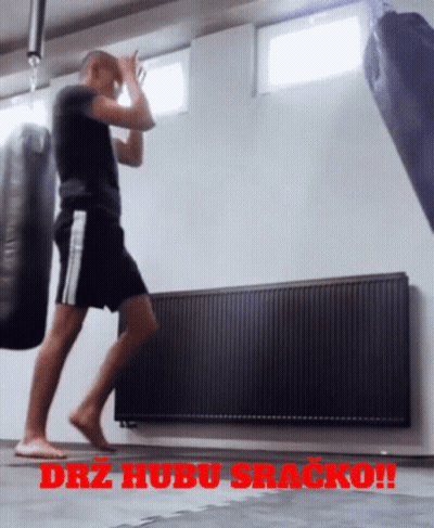 Man Standing Before Punching Bag With Drz Hubu Sracko GIF