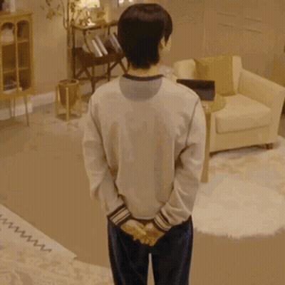 Man Standing Before Skull Crowd GIF