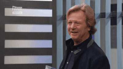 Man Standing Before Striped Wall Saying Prime GIF