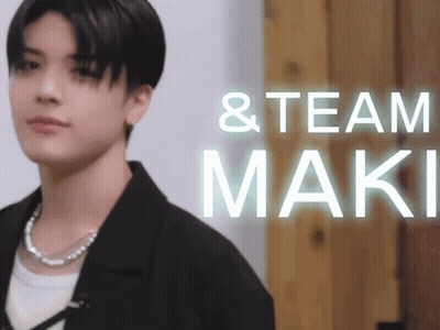 Man Standing Before Team Maki Sign GIF