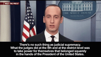 Man Standing Before White House Sign GIF