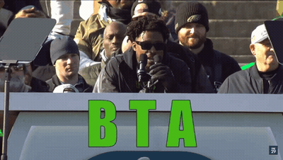 Man Standing Behind BTA Podium GIF