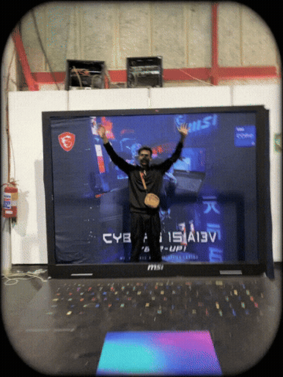 Man Standing By Large MSI Laptop GIF
