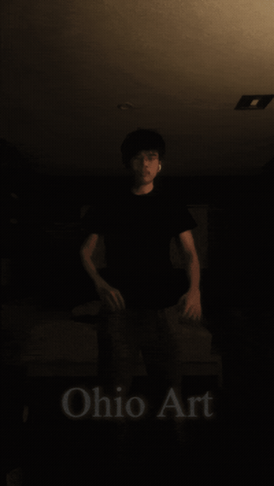 Man Standing By Large Yellow Ball GIF