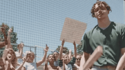 Man Standing By Sign: Twitter User @Tylerherrowld Is Here GIF