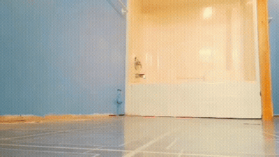 Man Standing In Bathroom Next To Bathtub GIF