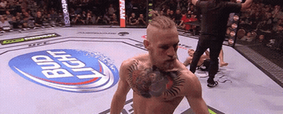 Man Standing In Boxing Ring With Bud Light Logo GIF