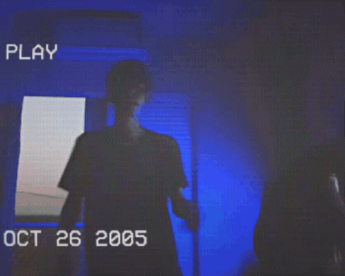 Man Standing In Dark Room Oct 26 2005 GIF