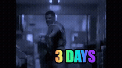 Man Standing In Dark Room With 3 Days Rainbow GIF