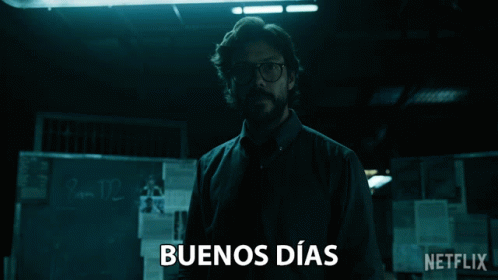 Man Standing In Dark Room With Buenos Dias On Bottom GIF