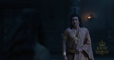 Man Standing In Dark Room With Crown GIF