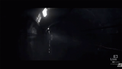 Man Standing in Dark Room With Microphone in Mouth