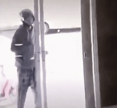 Man Standing In Doorway GIF