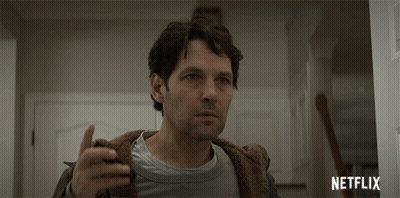 Man Standing In Doorway With Netflix Logo GIF