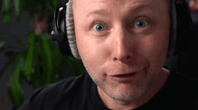 Man Standing In Field With Car And Rubbish On Face GIF