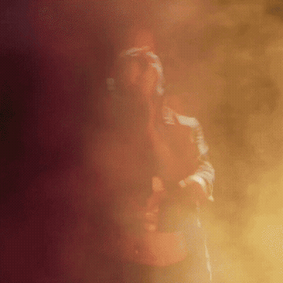 Man Standing In Foggy Room With Gun GIF