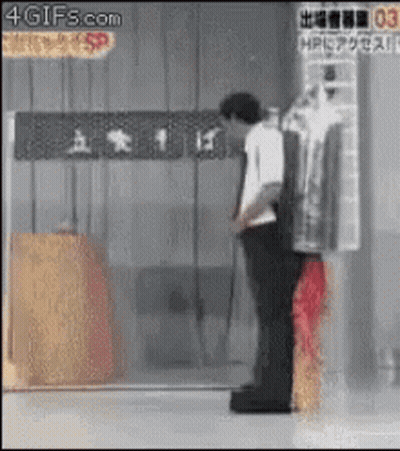 Man Standing In Front Of 4Gifs.com Sign GIF