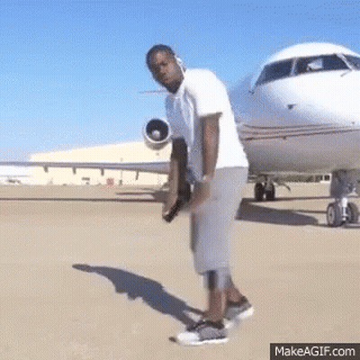 Man Standing In Front Of Airplane GIF