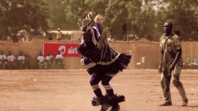 Man Standing In Front Of Airtel Sign GIF
